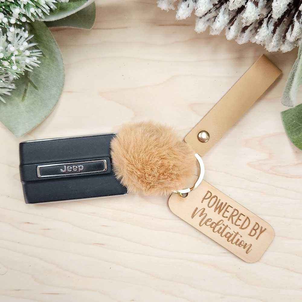 POWERED BY MEDITATION Laser Engraved Charm with Keychain Wristlet & Puff